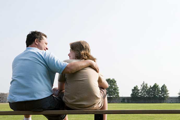 father-and-son-on-a-bench-2025-04-04-02-00-46-utc-aspect-ratio-700-525