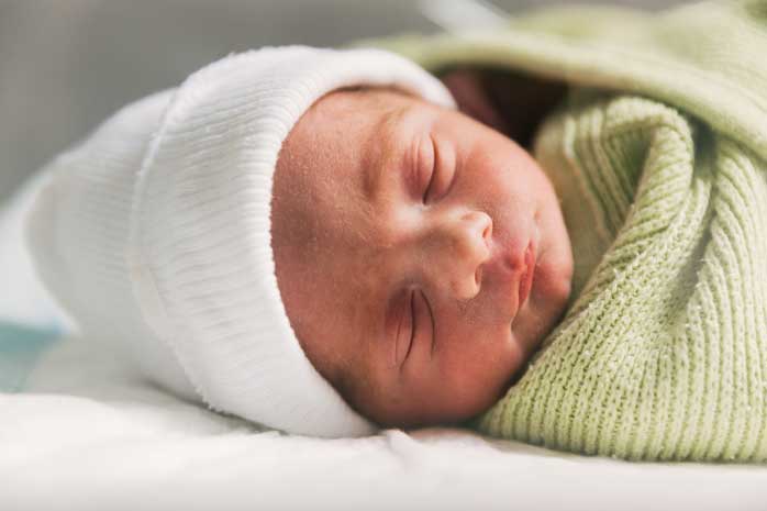 newborn-baby-sleeping-in-crib-babyhood-concept-2025-01-09-06-10-32-utc-aspect-ratio-700-525